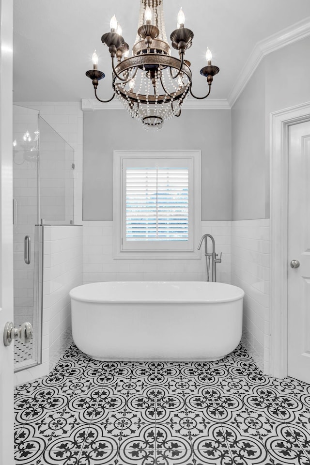 bathroom featuring tile patterned flooring, crown molding, independent shower and bath, and tile walls