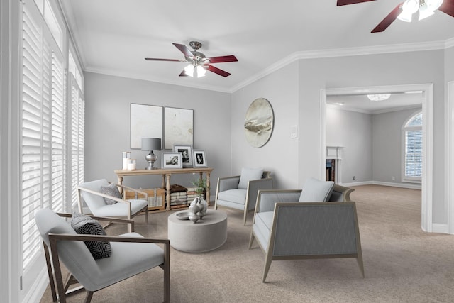 living room featuring ornamental molding, light colored carpet, and ceiling fan