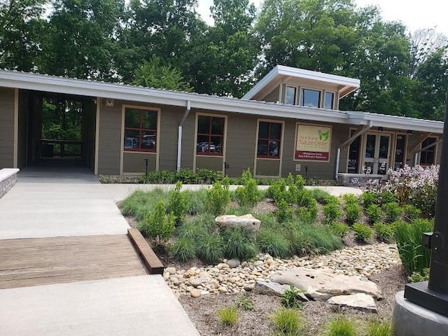 view of front of home featuring a carport