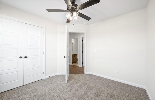 unfurnished bedroom featuring ceiling fan, carpet floors, and a closet