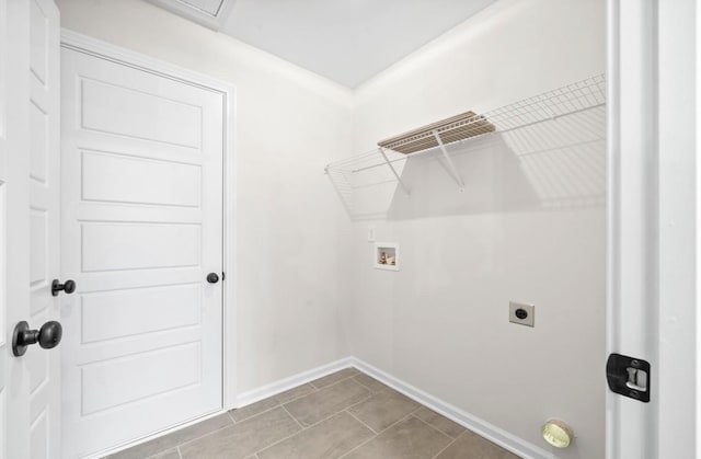 clothes washing area with washer hookup, hookup for an electric dryer, and light tile patterned floors