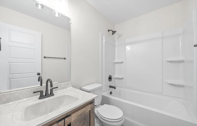 full bathroom featuring shower / washtub combination, vanity, and toilet