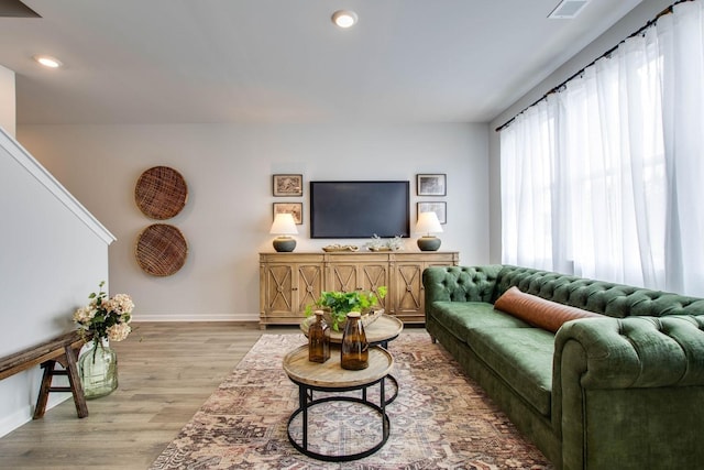 living room with light hardwood / wood-style floors