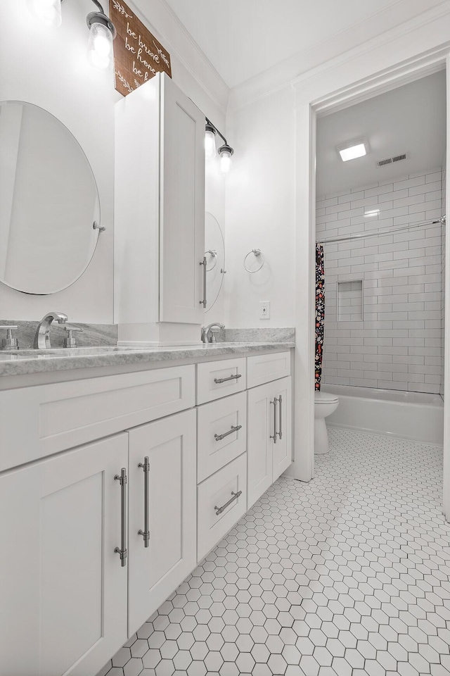 full bathroom with toilet, crown molding, vanity, shower / bath combo with shower curtain, and tile patterned flooring