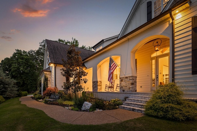 view of exterior entry at dusk