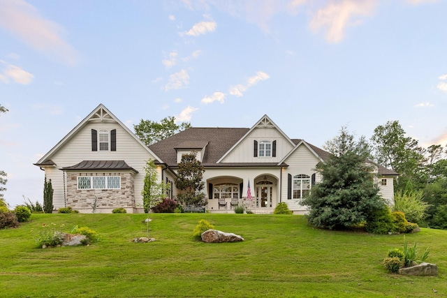 view of front of property with a porch and a front yard