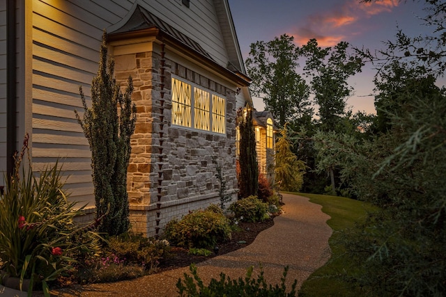 view of property exterior at dusk