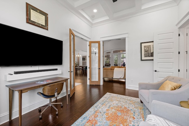 office featuring french doors, dark wood-type flooring, coffered ceiling, beamed ceiling, and a towering ceiling