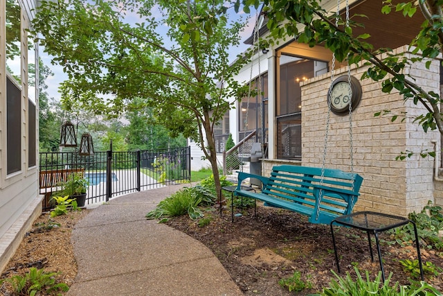 surrounding community with a patio and a swimming pool