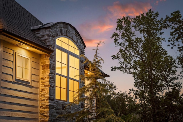 view of property exterior at dusk