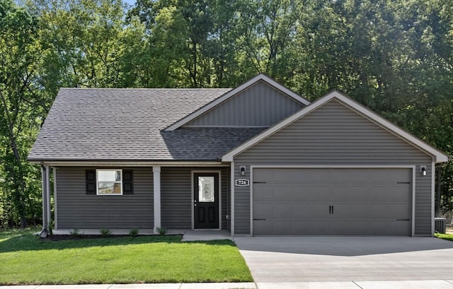 view of front facade with a garage and a front yard