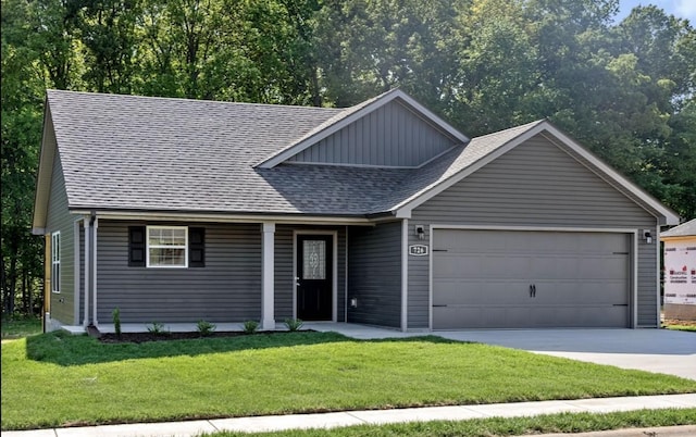 view of front of house with a garage and a front yard