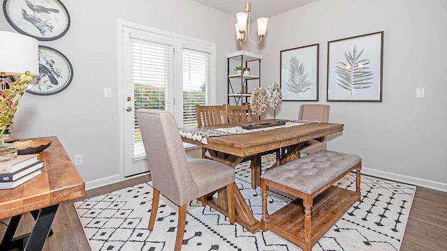 dining area with a chandelier and light wood-type flooring