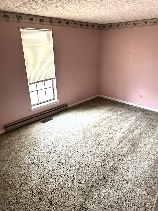 unfurnished room featuring a baseboard radiator, carpet floors, and a textured ceiling