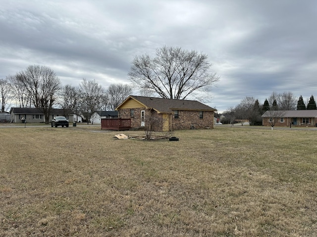 view of yard featuring a wooden deck