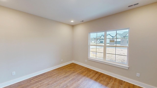 empty room featuring hardwood / wood-style flooring