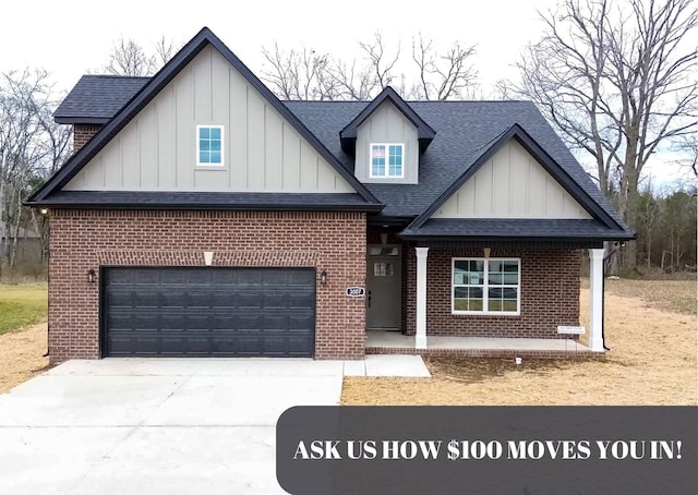 view of front of house with brick siding, a shingled roof, board and batten siding, a garage, and driveway