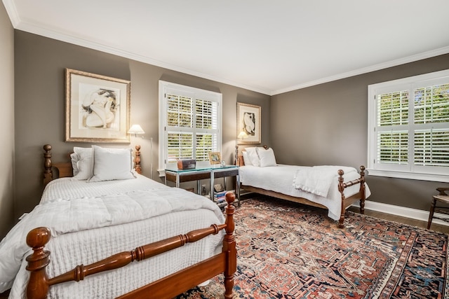 bedroom featuring ornamental molding and hardwood / wood-style floors