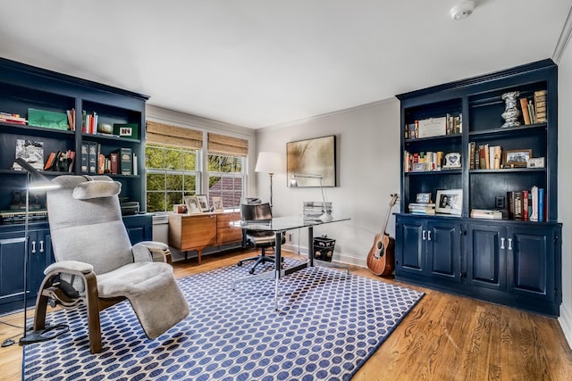 office space featuring crown molding and hardwood / wood-style floors