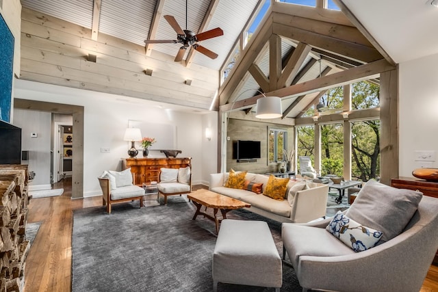 living room with ceiling fan, wood-type flooring, and high vaulted ceiling