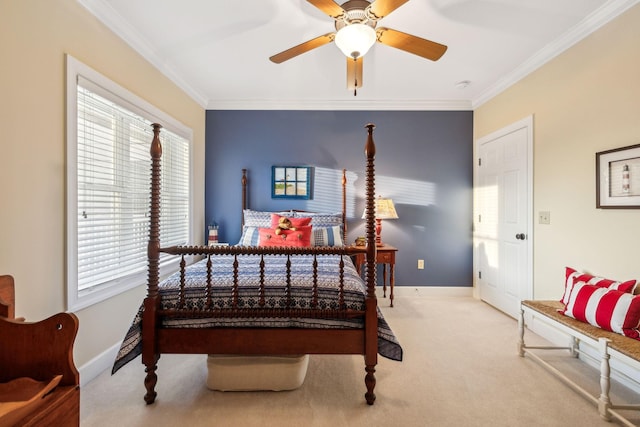 bedroom featuring ornamental molding, light colored carpet, and ceiling fan