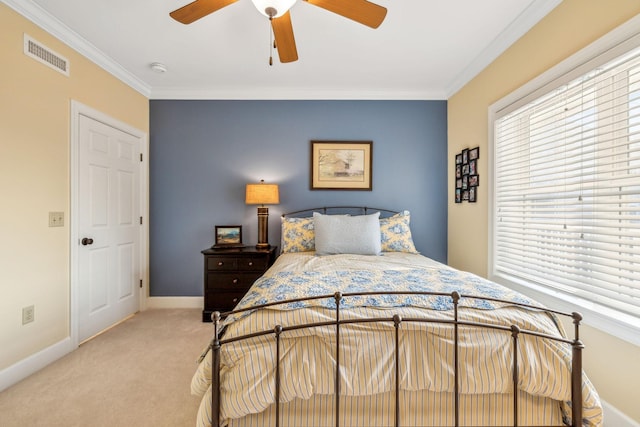 bedroom featuring crown molding, multiple windows, ceiling fan, and light carpet