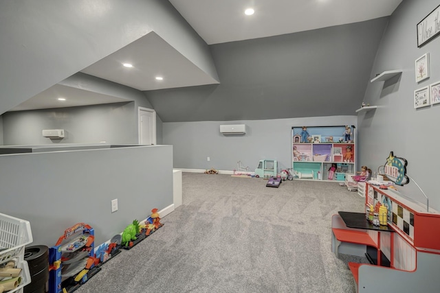 recreation room with a wall mounted air conditioner, carpet flooring, and vaulted ceiling