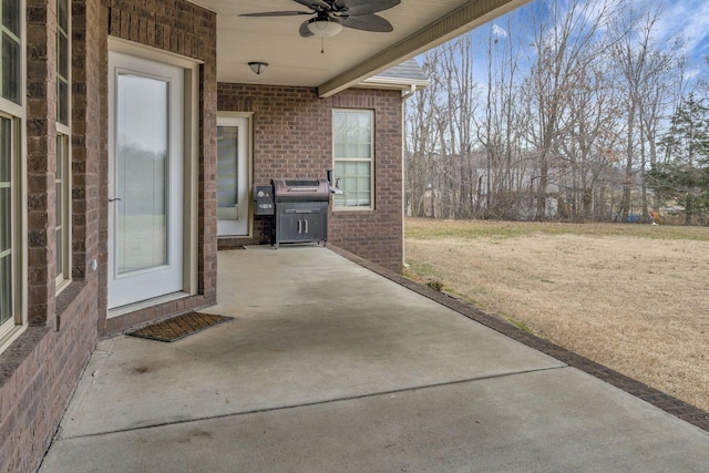 view of patio / terrace featuring area for grilling and ceiling fan