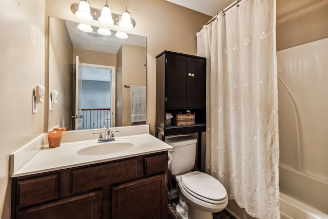 full bathroom featuring vanity, toilet, and shower / tub combo