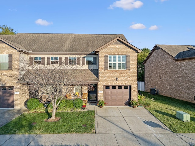 view of front of home featuring a garage and a front lawn