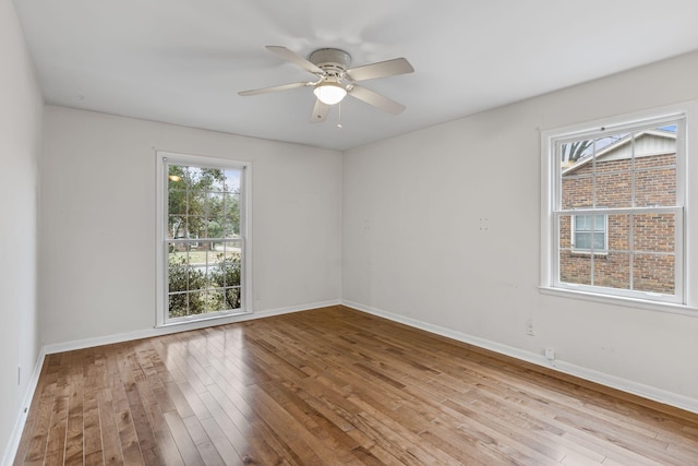 unfurnished room featuring ceiling fan and light hardwood / wood-style floors