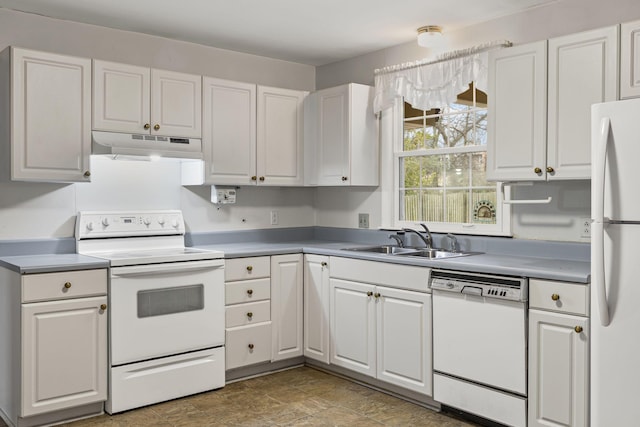 kitchen featuring white cabinetry, sink, and white appliances