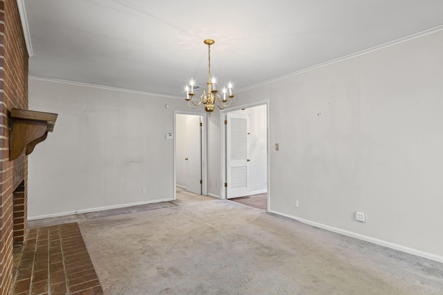 interior space featuring dark carpet, a brick fireplace, crown molding, and a chandelier