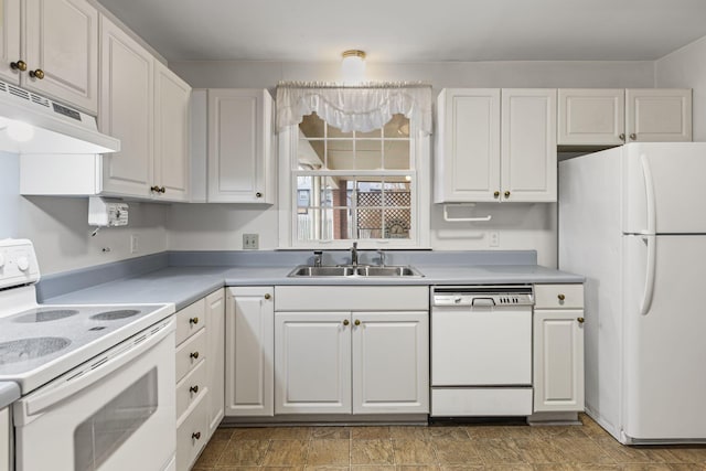 kitchen featuring white appliances, sink, and white cabinets