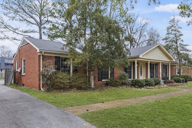 view of front of property with a porch and a front yard