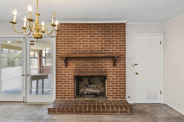 unfurnished living room with ornamental molding, a brick fireplace, carpet, and a chandelier