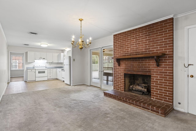 unfurnished living room with ornamental molding, a chandelier, light colored carpet, and a fireplace