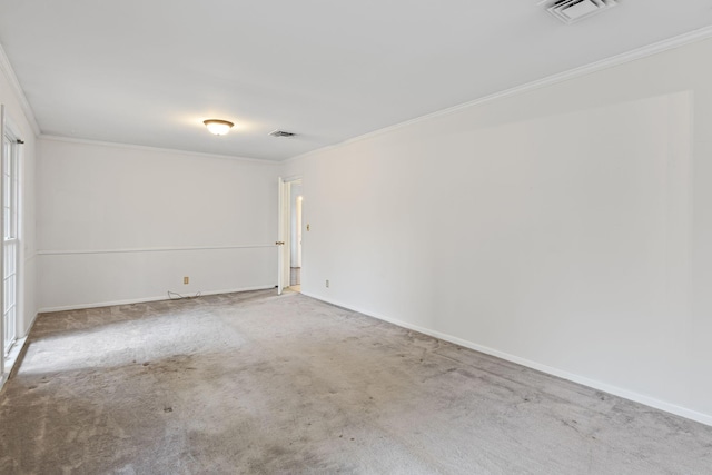 carpeted empty room with crown molding