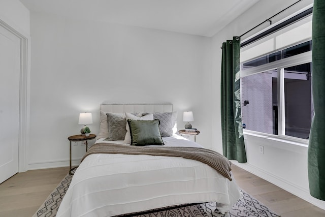 bedroom with light hardwood / wood-style flooring