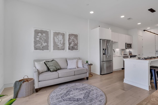 living room featuring light wood-type flooring