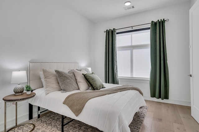 bedroom featuring light hardwood / wood-style flooring