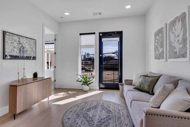 living room with light hardwood / wood-style floors