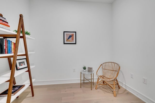 living area with light hardwood / wood-style floors