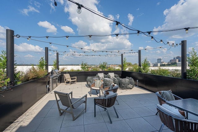 view of patio featuring an outdoor living space and an outdoor kitchen