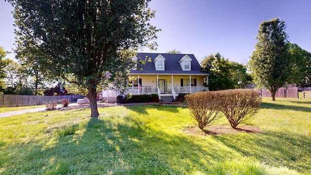 view of front of property with a front yard and covered porch