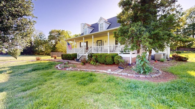 view of front of house featuring a porch, central AC, and a front lawn