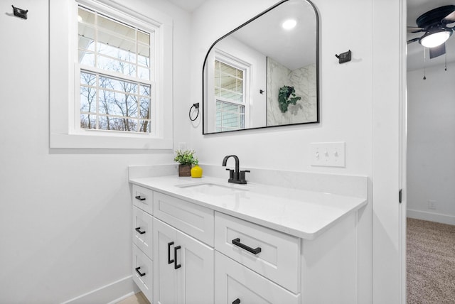 bathroom with ceiling fan and vanity