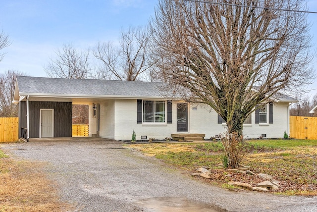 ranch-style house with a carport