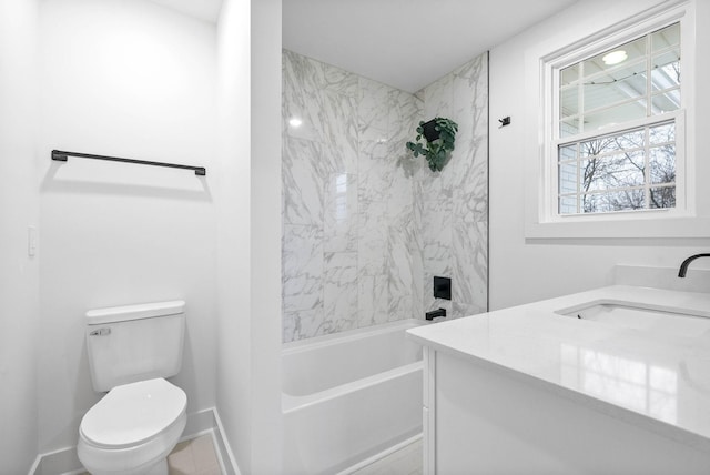 full bathroom with tiled shower / bath combo, vanity, and toilet