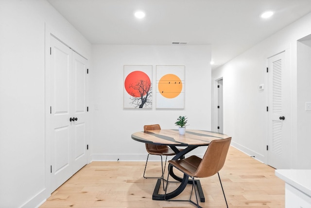 dining area featuring light wood-type flooring